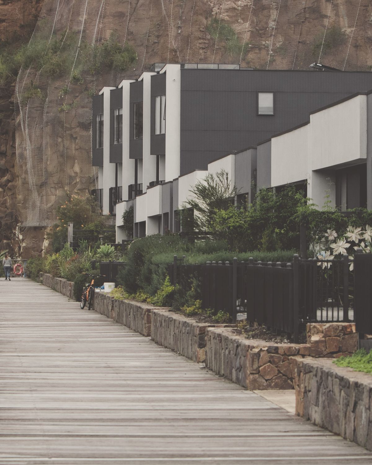 Modern townhouse development with waterfront boardwalk